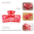 Detail of pink marble acetate hair claw showing 7.5cm size and premium texture - Red
