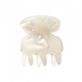 Close-up of pearl white acetate mini hair claw clip with a glossy iridescent finish - White