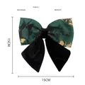 Detail of vintage 15cm bow hair clip featuring dark green floral jacquard and velvet - Green