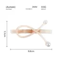 Dettaglio della clip per capelli in acetato misure 8,8 cm x 5,5 cm con perle eleganti - Arancione