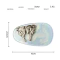 Dettaglio del fermaglio a farfalla in acetato, dimensioni 4cm x 2,3cm e peso di 5,4g - Blu