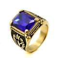 Detail of vintage gold ring with large faceted blue gemstone and black floral relief - Size 7 / Gold Base Blue Gemstone