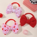 Set di tre elastici per capelli con fiocco a cuori in tessuto waffle rosso e bianco - Confezione Tripla Cuore