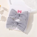 Set of two gray gingham hair clips with scalloped edges on a display card for girls - Gray White Plaid