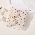 Set of two beige waffle fabric hair bows with brown polka dots on a display card - Beige Grid Coffee Dots