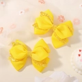 Set of two yellow layered ribbon hair bows with golden glitter trim for girls - Bright Yellow