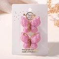 Deux pinces à cheveux papillon en tricot rose faites à la main avec détails dorés - Rose Clair