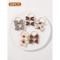 Set of 10 brown and beige bow hair ties for toddlers on a decorative white plate - Apricot Small Flower Plaid