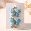 Paire de barrettes papillon tricotées à la main bleu ciel avec détails dorés - Bleu ciel