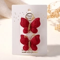 Lot de deux pinces à cheveux papillon en tricot rouge foncé faites à la main - Rouge