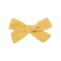 Detail shot of mustard yellow cotton linen fabric bow clip with natural handmade texture - Ginger Yellow Style (10)