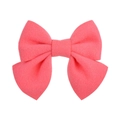 Detail shot of the coral pink fabric texture on a handmade double-layered hair bow - Coral Pink (15)