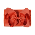 Detail shot of orange baby nylon headband with a large textured grosgrain ribbon bow - Orange Red (227-765-065)