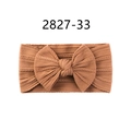 Soft nylon baby headband in ginger yellow featuring a large knitted bow design - Tan Yellow (33)