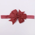Elastic baby headband with a vibrant red grosgrain ribbon bow and textured finish - Red (780)