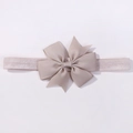 Soft elastic baby headband with champagne ribbed grosgrain bow on plain white background - Light Beige (823)
