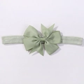 Elastic baby headband with a large sage green grosgrain ribbon bow on a white background - Bean Green (567)