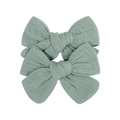 Close-up of two pieces fabric bow hair clips in sage green with soft woven texture - Sage Green Style (113)