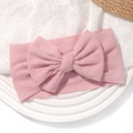 Pink ribbed baby headband featuring a large bow on a soft elastic nylon band for infants - Soft Pink (No. 2)