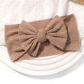 Brown ribbed baby headband featuring a large bow on a decorative white display tray - Brown (No. 4)