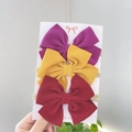 Detailed view of three baby bow headbands with ribbed texture on high-stretch nylon bands - Combination Set / Purple Yellow Red