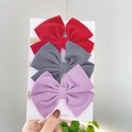 Three-piece waffle fabric baby bow headbands in red, grey, and purple on display card - Combination Set / Red Gray Purple