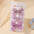 Lot de trois barrettes à nœuds violets avec motifs floraux, à carreaux et unis sur carte - Série Violette Ensemble