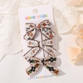 Lot de trois barrettes à nœuds en tissu floral rétro sur carte de présentation artisanale - Mix Vintage Floral Orange Vert Noir (3E)