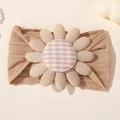 Soft nylon baby headband in light brown featuring a large sunflower with plaid center - Caramel color