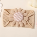 Beige ribbed nylon baby headband featuring a soft large floral bloom with pink checkered core - Apricot