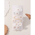 Cute set of white daisy embroidery hair clips for girls with warm orange floral centers - Style 6G
