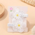 Set of two white daisy embroidery hair clips on a pink display card for girls - Style 2A-28