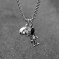 Vintage silver magnetic couple necklace featuring detailed astronaut and planet pendants - Single Astronaut Holding Star