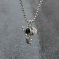 Magnetic astronaut couple necklace with silver astronaut charm and heart-shaped pendant - Single Astronaut Picking Star