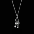 Vintage silver astronaut necklace with a small star pendant on a black background - Star-hugging Astronaut / Cable Chain