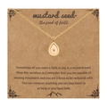 Golden mustard seed necklace with a transparent teardrop pendant on gift card - Waterdrop-Gold