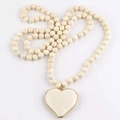 Handmade white turquoise beaded long necklace featuring a gold-edged heart pendant - White