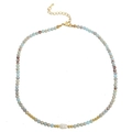 Detail of beaded necklace with blue stones, a center white pearl, and gold lobster clasp - Shoushan Stone Necklace