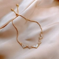 Adjustable gold chain bracelet featuring white enamel and pavé heart charms on silk - Kc Gold 1835