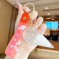 Pink quicksand ice cream keychain with 3D bunny ears and silicone wrist strap - Ice Cream Bubble Style / White