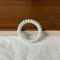 White spiral telephone wire hair tie with pink and yellow polka dots - Blue