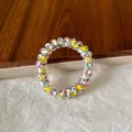 Clear spiral telephone wire hair tie featuring vibrant cartoon character patterns - Colorful Cat Hair Tie