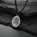 Macro view of Saint Michael oval pendant with engraved protector text on black rock base - Bead Chain Style / Black Necklace