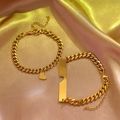 Bracciali a catena cubana dorati coordinati per coppie con ciondoli a cuore e barra su raso - Oro
