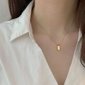 Detail of minimalist gold rectangular pendant on a sleek snake chain necklace - 50cm+5cm / Gold