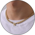 Golden stainless steel Cuban chain necklace with Leo zodiac pendant on white shirt - Leo