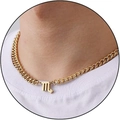 Golden Scorpio zodiac pendant on a curb chain necklace shown on a model neck - Scorpio