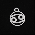 Macro shot of silver Cancer zodiac pendant with hollow design on black velvet - Cancer