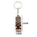 Detail view of bone-like resin Tiki keychain showing dimensions 5.6cm by 1.8cm - Dark Brown Idol Style (A-1)