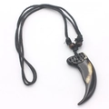 Close-up of wolf tooth resin pendant with tribal beads on adjustable black cord necklace - Black